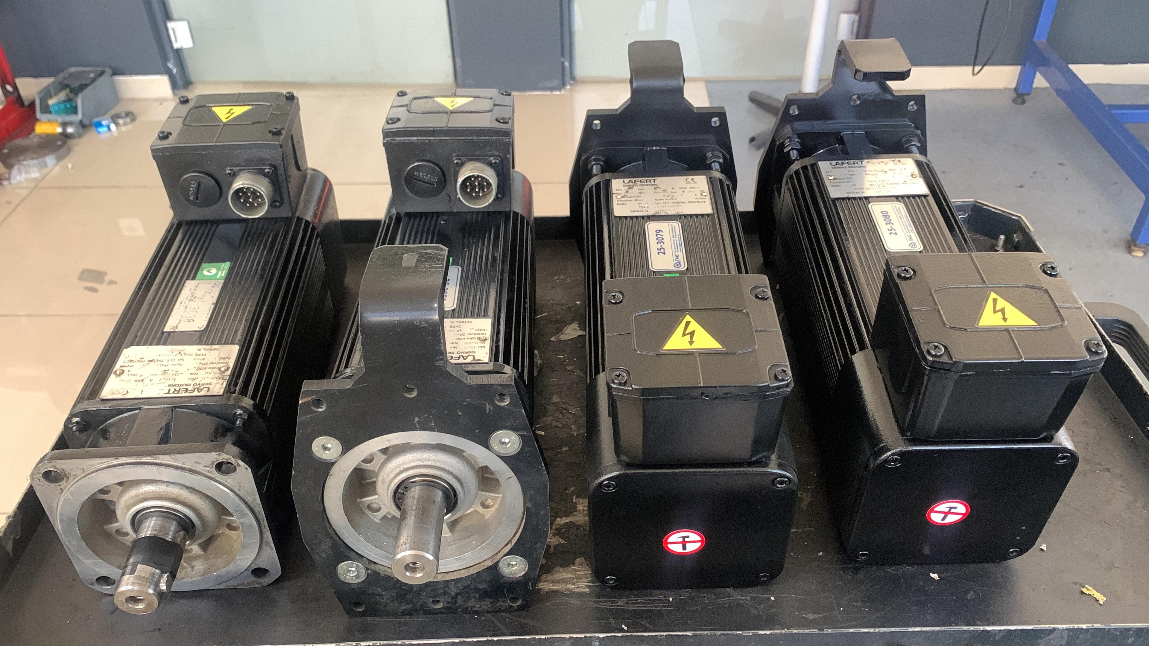 Four servo motors lined up side by side