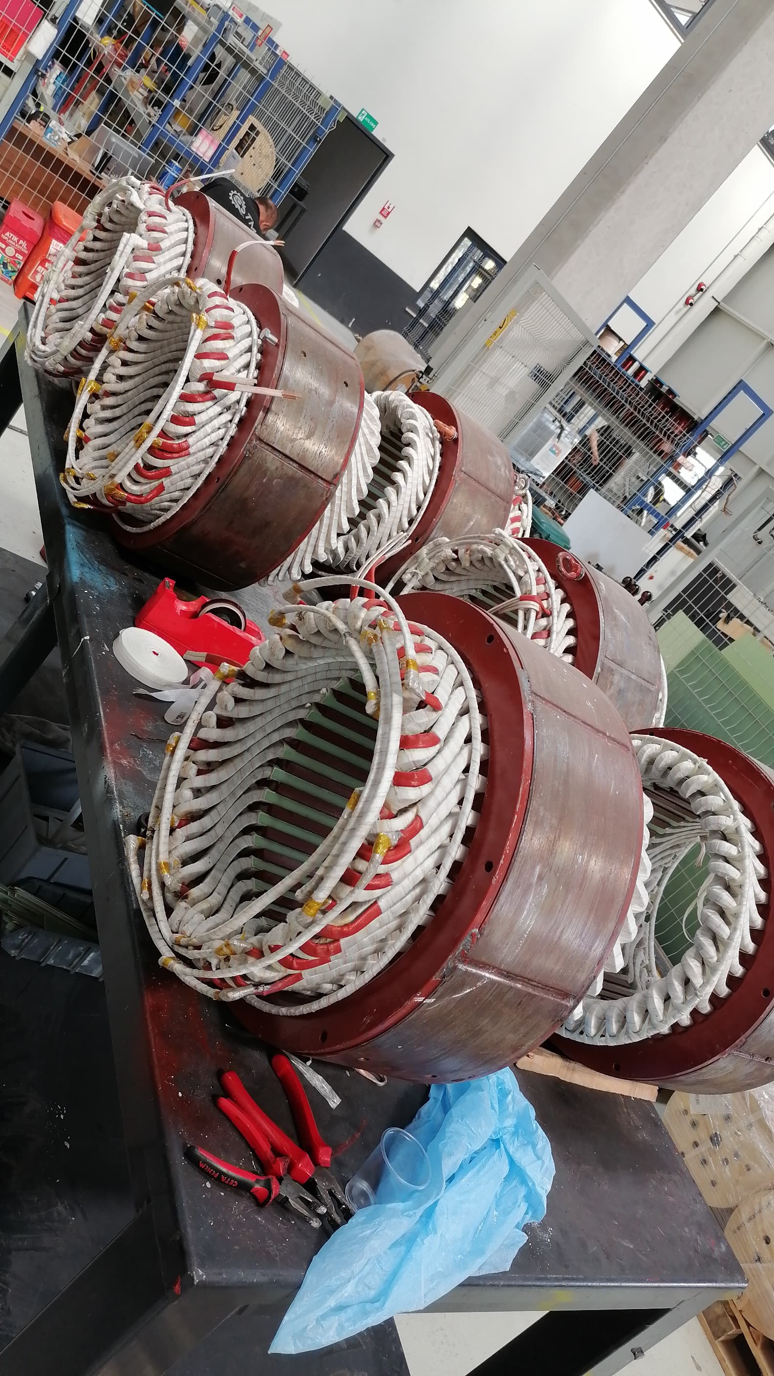 Stator coil groups lined up on the workbench