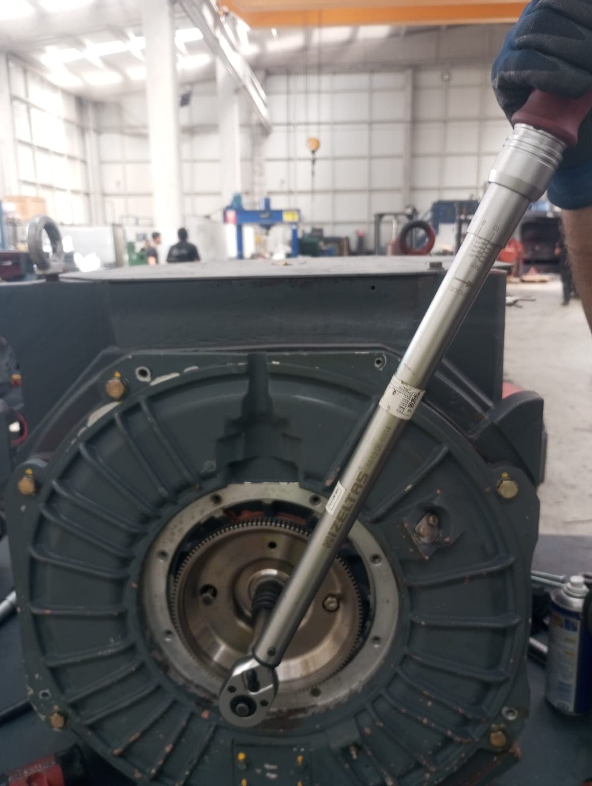 Tightening motor end shield bolts with a torque wrench