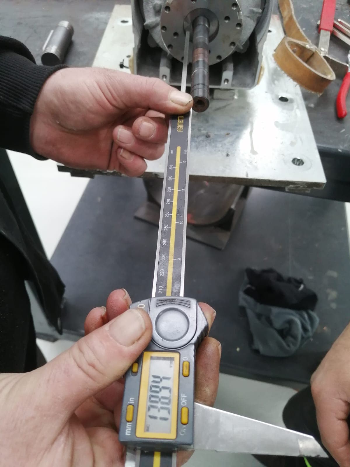 Measuring a part with a caliper