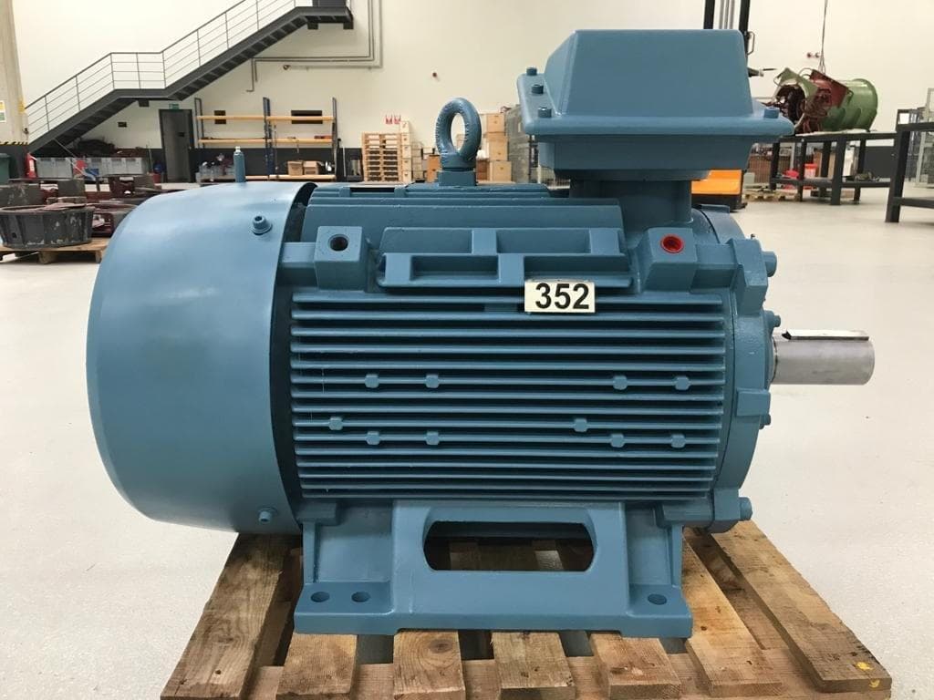 A blue induction motor arriving for overhaul