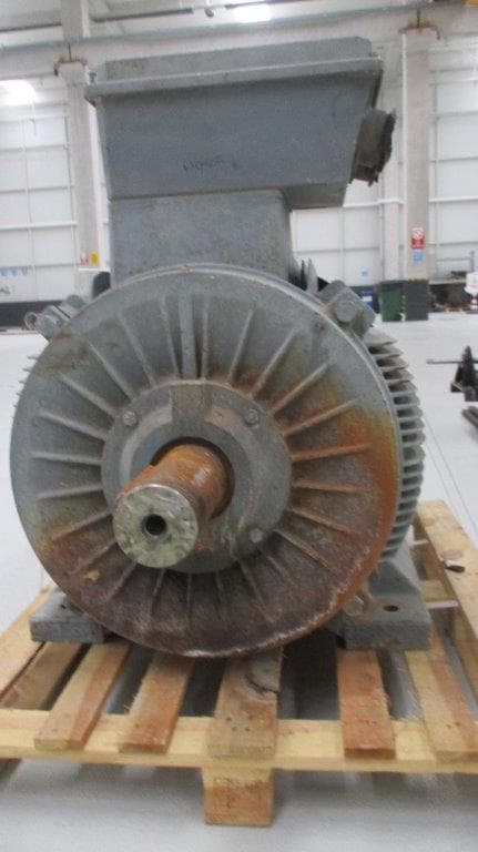 A grey motor seen from the fan end